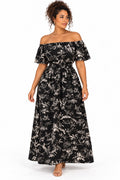 Robe noire à fleurs blanches